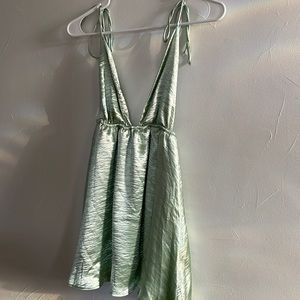 Never been worn skater style dress! Shiny green silky material with great flow.
